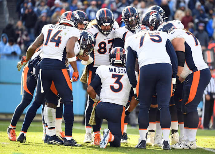 Denver Broncos quarterback Russell Wilson (3) talks in a huddle during the second half against the Tennessee Titans at Nissan Stadium.